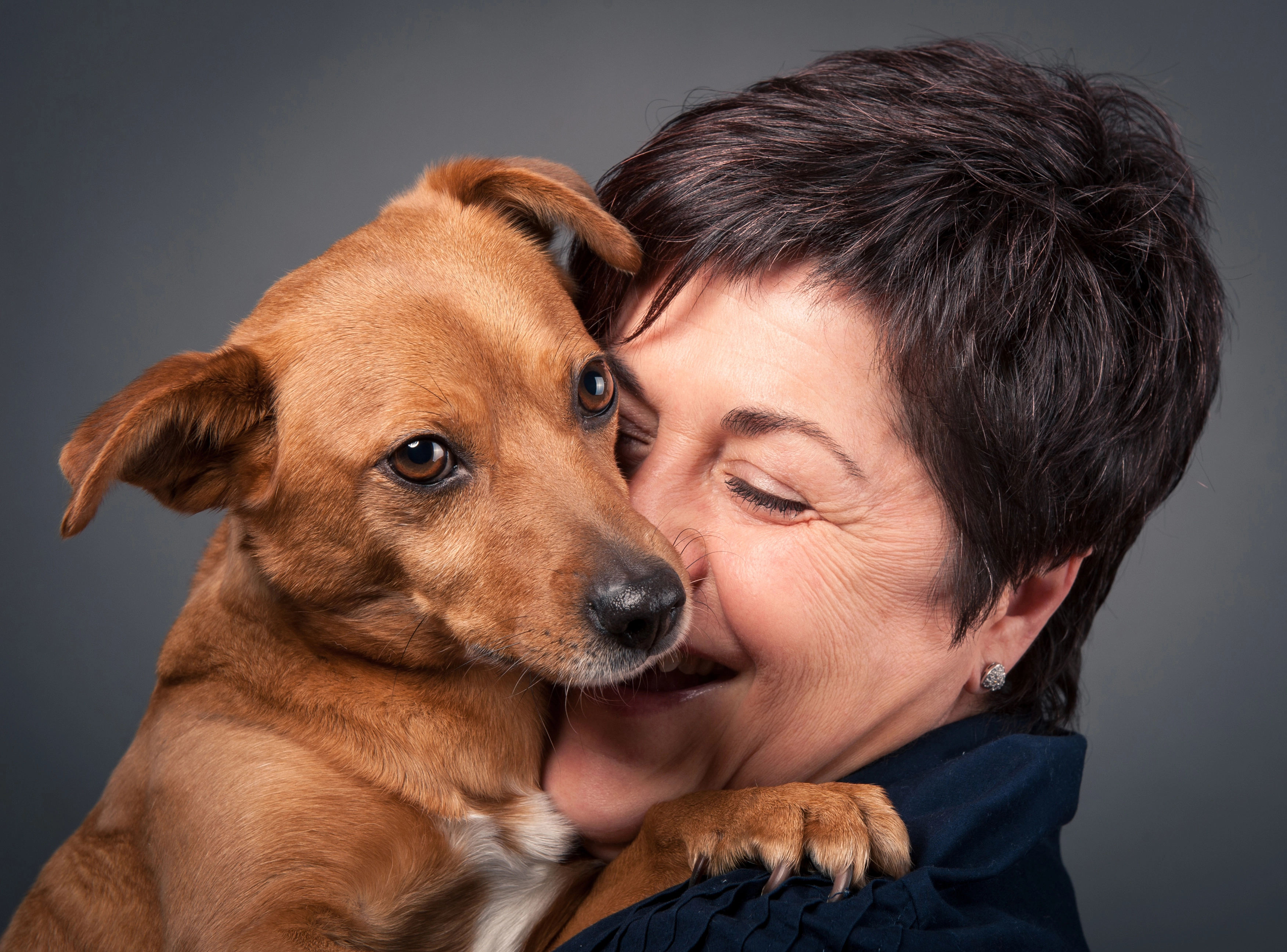 Woman hugging her dog